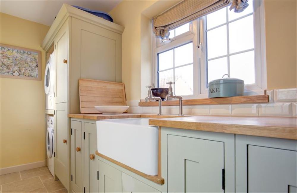 Ground floor: The Kitchen is bright and spacious and has a butler sink at The Lifeboat House, Brancaster near Kings Lynn