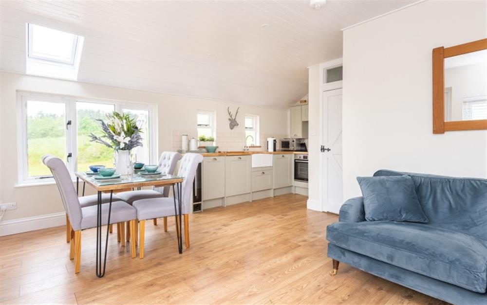 Open-plan dining area with views to garden at The Linhay, Chipton Barton in Dittisham
