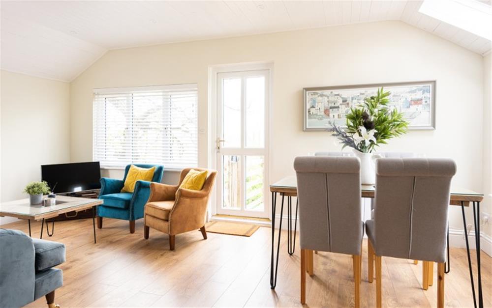 Open-plan living room with wooden clad ceiling at The Linhay, Chipton Barton in Dittisham