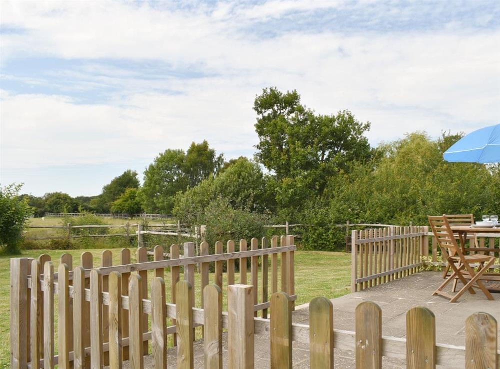 Fenced patio area at The Little Barn in Woodchurch, near Ashford, Kent