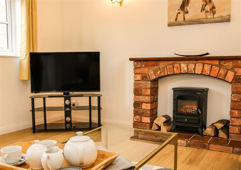 Relax in the living area at The Little Beehive, Abberley