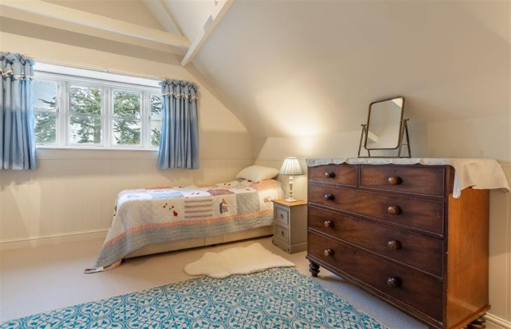 First floor: Bedroom three has two single 2ft6 beds and views over the garden at The Little House, Brancaster near Kings Lynn