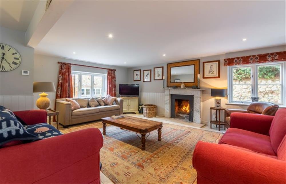 Ground floor: Living area with open fire at The Little House, Brancaster near Kings Lynn
