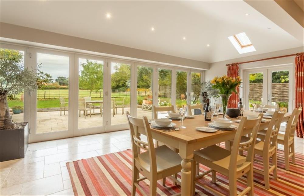 Ground floor: The dining area is light and bright with bi-fold doors to the garden (photo 2) at The Little House, Brancaster near Kings Lynn