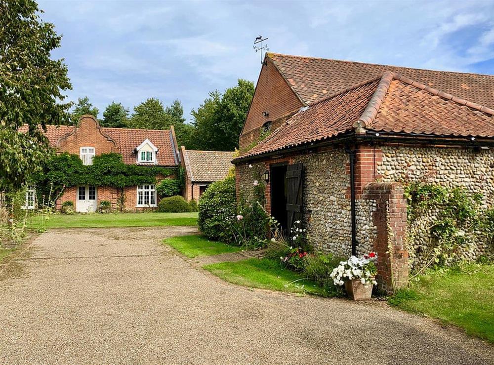 The gravelled drive provides ample parking at The Little House in Hempstead, near Holt, Norfolk