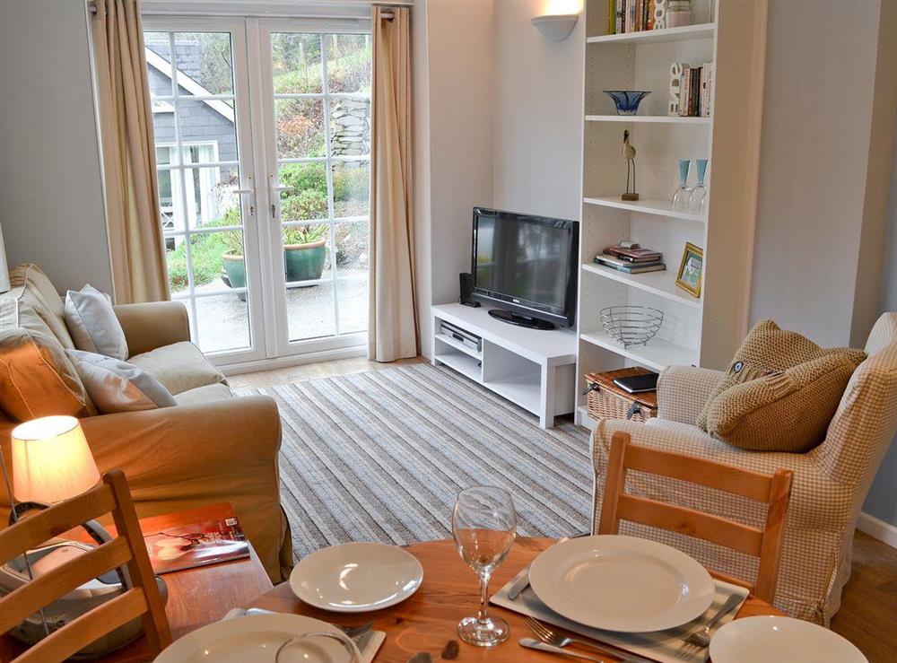 Living room with patio doors at The Little House in Twelveheads Truro, near Redruth, Cornwall