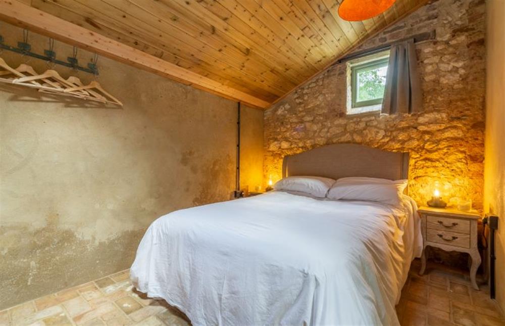 Ground floor: Bedroom with double bed at The Little Potting Shed, Fring near Kings Lynn