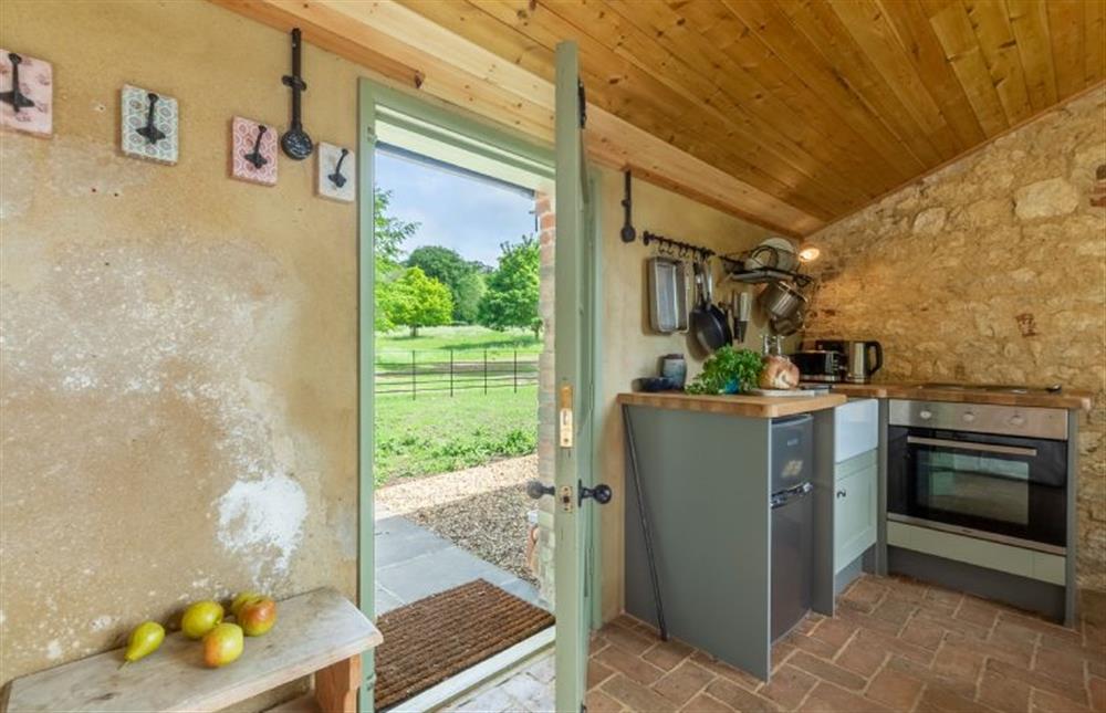 Ground floor: Door leading to private area outside and views over Fring Estate at The Little Potting Shed, Fring near Kings Lynn