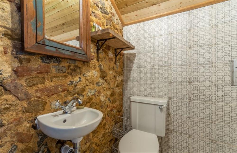 Ground floor: shower room has rustic walls at The Little Potting Shed, Fring near Kings Lynn