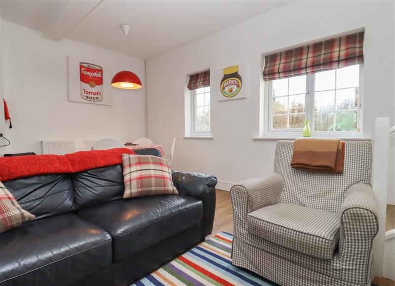Relax in the living area at The Little White Cottage, Milton-Under-Wychwood