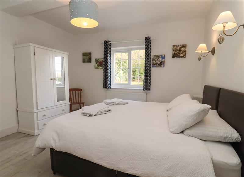 This is a bedroom at The Little White Cottage, Milton-Under-Wychwood