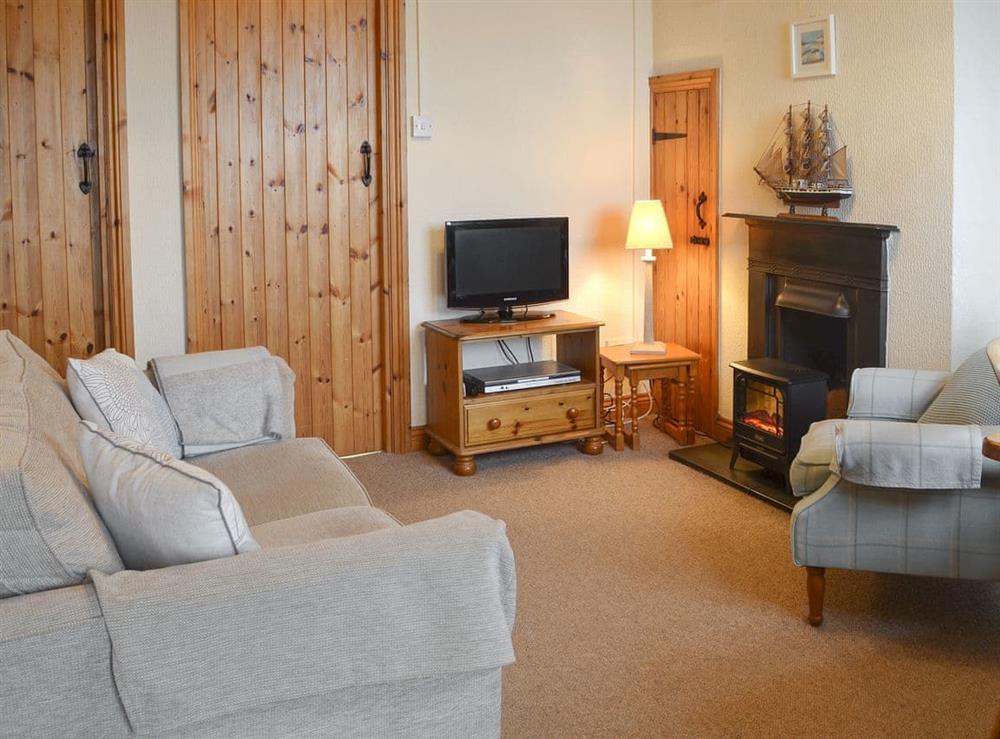 Comfortable living/ dining room at The Lobster Pot in Trefor, near Caernarfon, Gwynedd