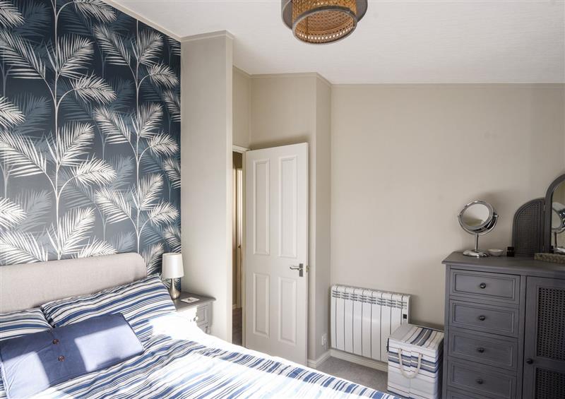 A bedroom in The Lodge @ Clifftop Park at The Lodge @ Clifftop Park, Charmouth