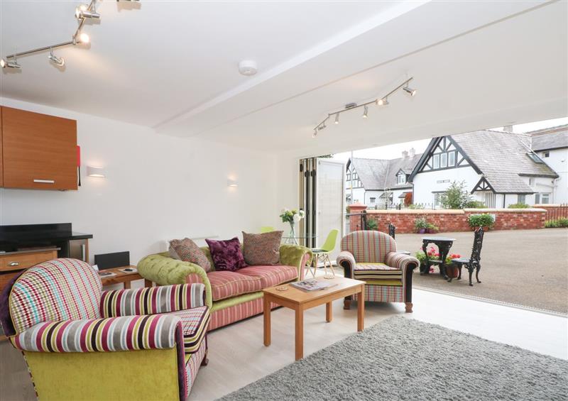 Enjoy the living room at The Lodge at Cross Cottage, Holt