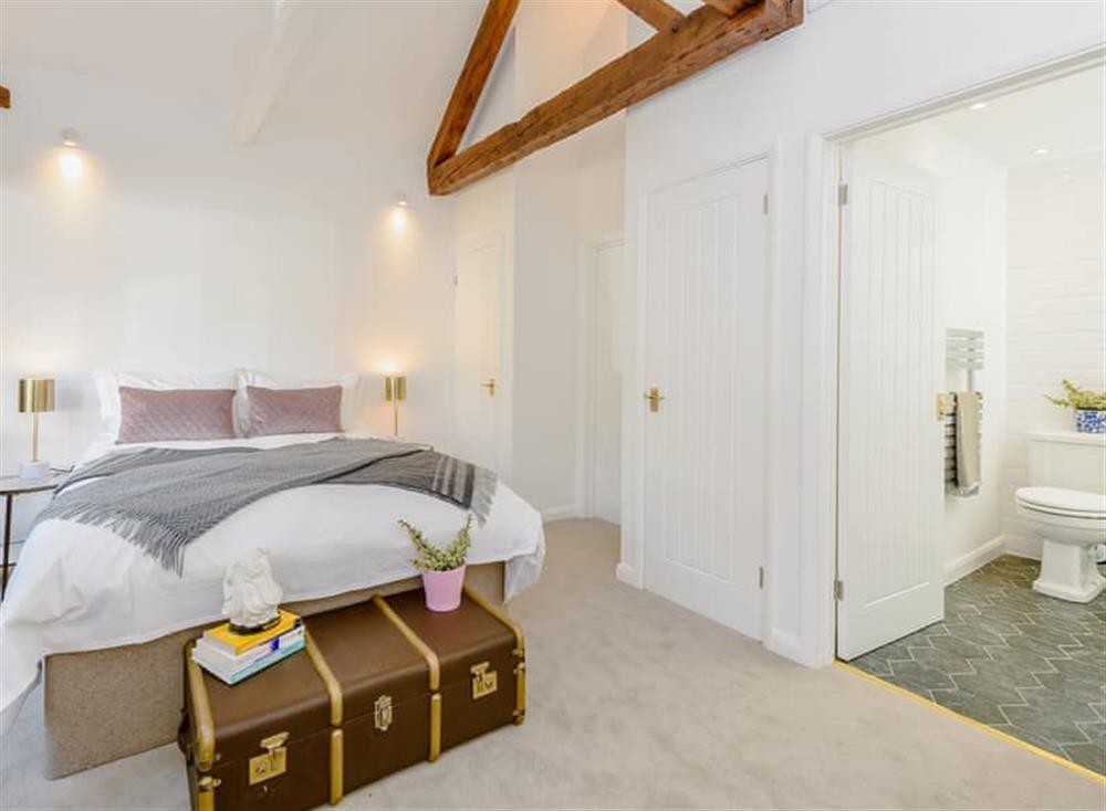 Spacious master bedroom at The Lodge at Oldbury Barns in Chichester, England