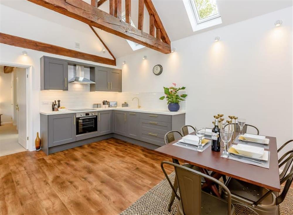 Well presented kitchen/ dining area at The Lodge at Oldbury Barns in Chichester, England