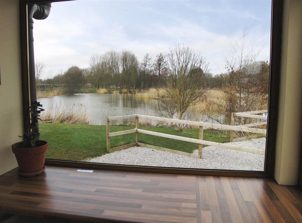 View over the lake from the sunroom at The Lodge in Brandesburton, near Driffield, North Humberside