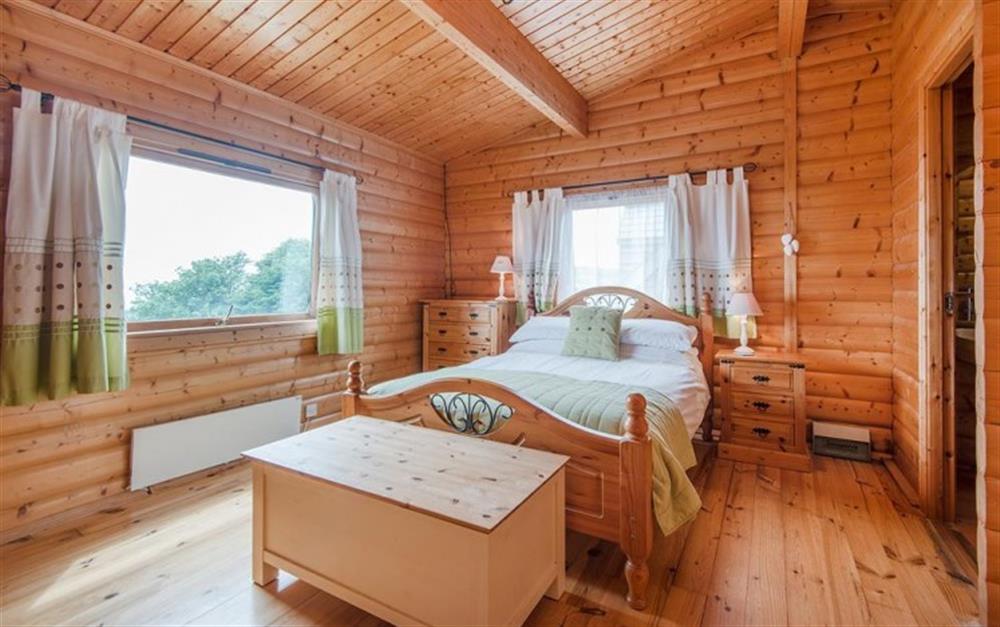 Double bed with en-suite and sea views in bedroom 2 at The Lodge in Lyme Regis