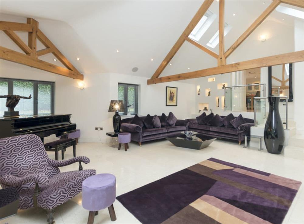 Stylish open plan living room complete with mini grand piano at The Lodge in North Duffield, near York, North Yorkshire