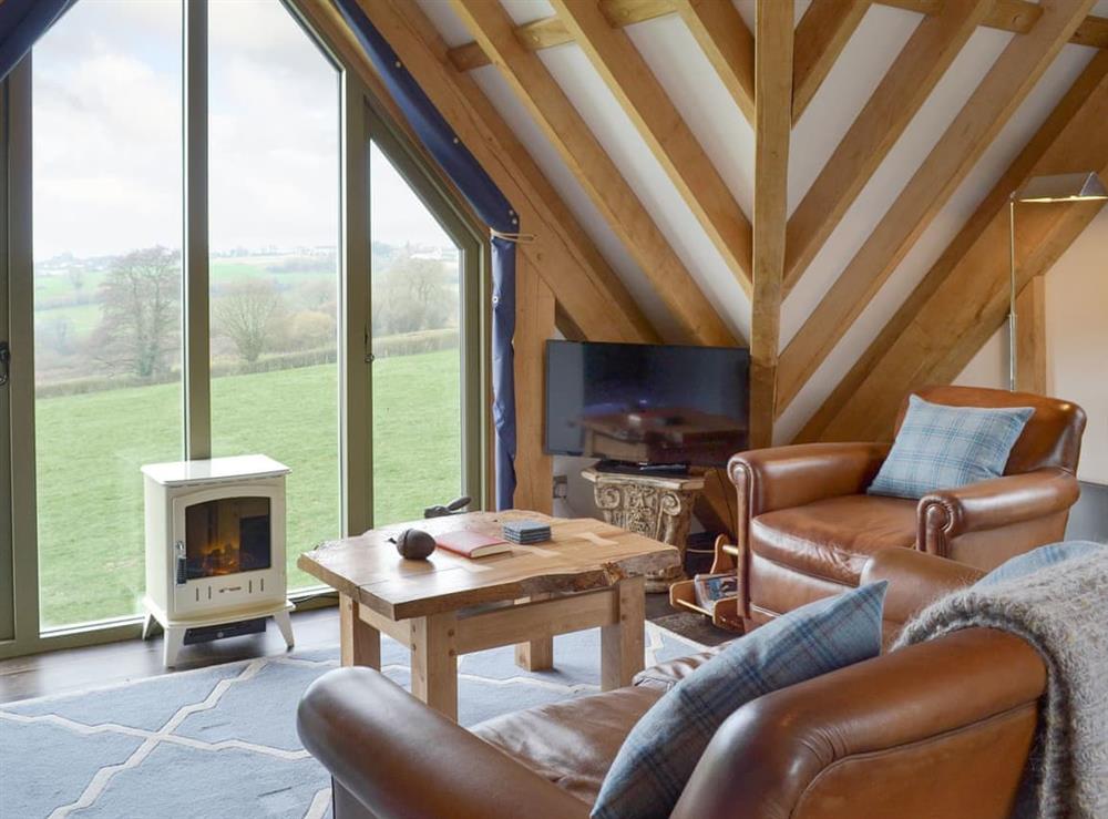Welcoming living area with stunning rural views at The Lodge in Sandley, near Shaftesbury, Dorset