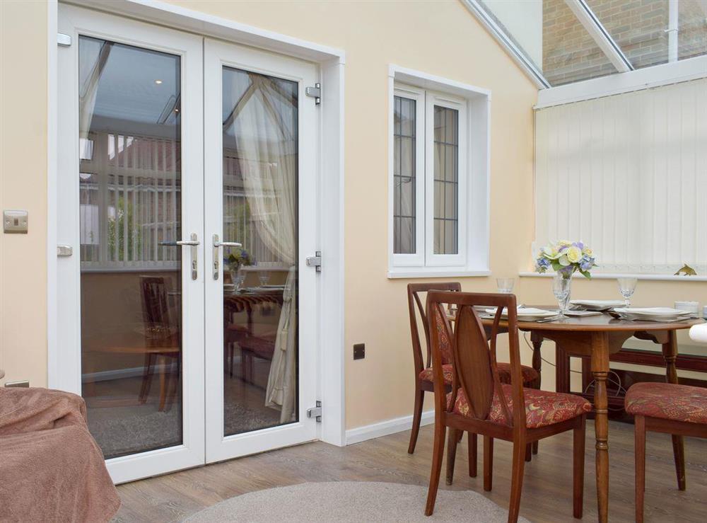 Conservatory with additional seating and dining area at The Lodge in Shanklin, Isle of Wight