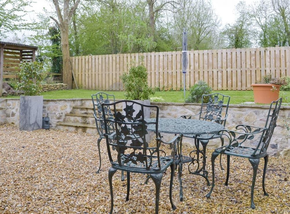 Split-level garden with patio area at The Lodge in Wedmore, near Cheddar, Somerset