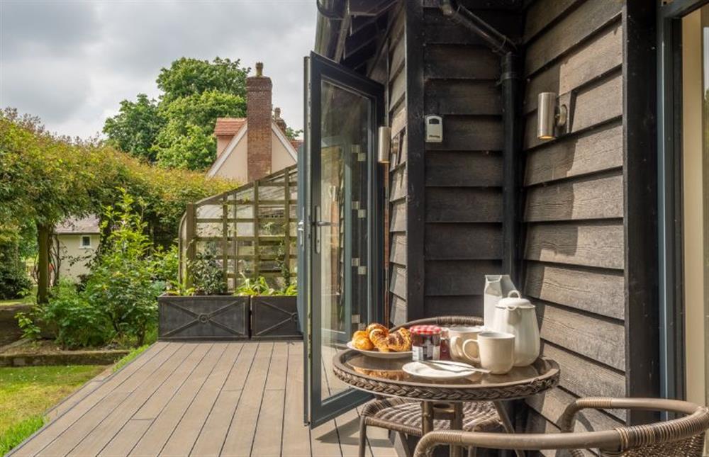 Terrace overlooking the garden with views of Valley Farm House at The Lodge, Wherstead, Wherstead