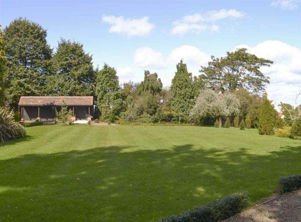 Large shared lawned garden at Bluebell Lodge, 