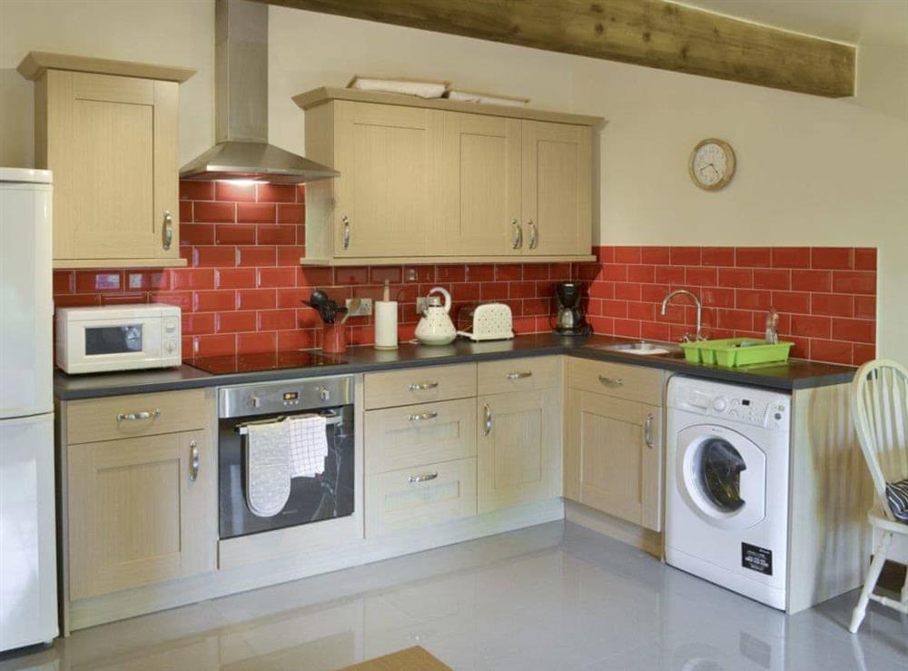 Well-equipped kitchen area at Bluebell Lodge, 