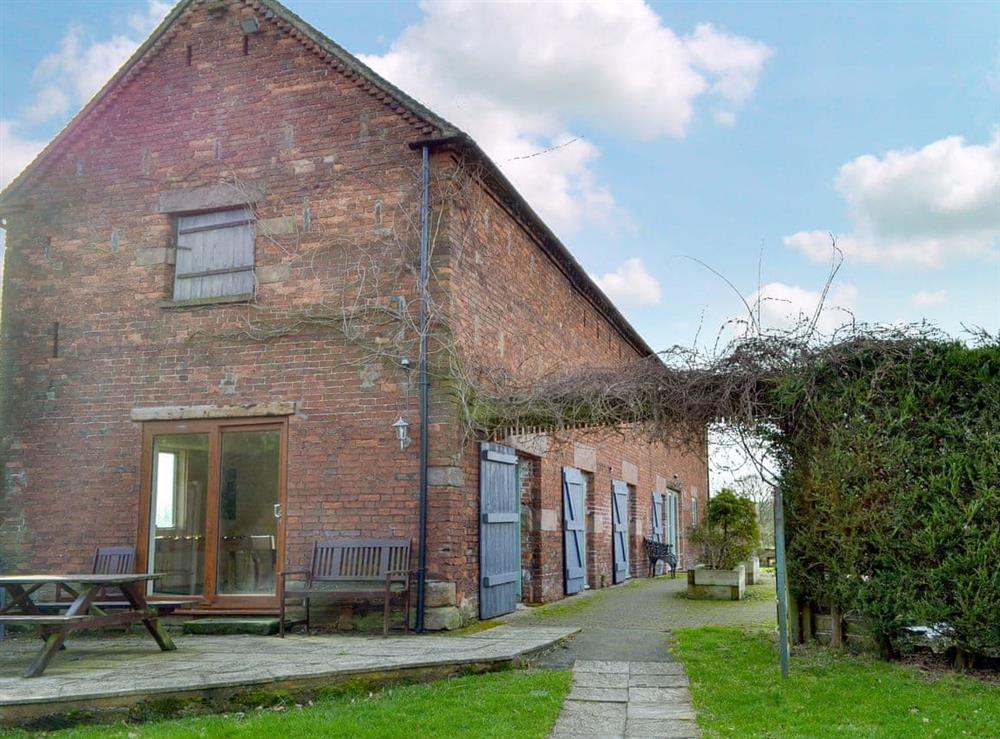 Enclosed garden with patio and furniture at The Long Barn in Stoke-On-Trent, Staffordshire