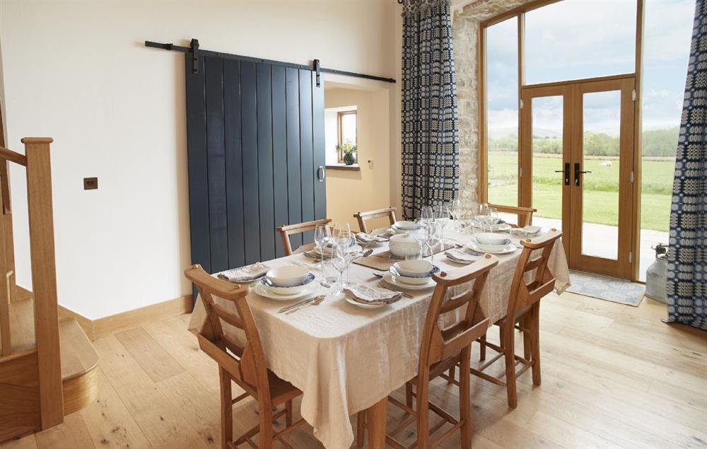 Elegant dining table with seating for six guests at The Longbarn at Caerfallen, Ruthin