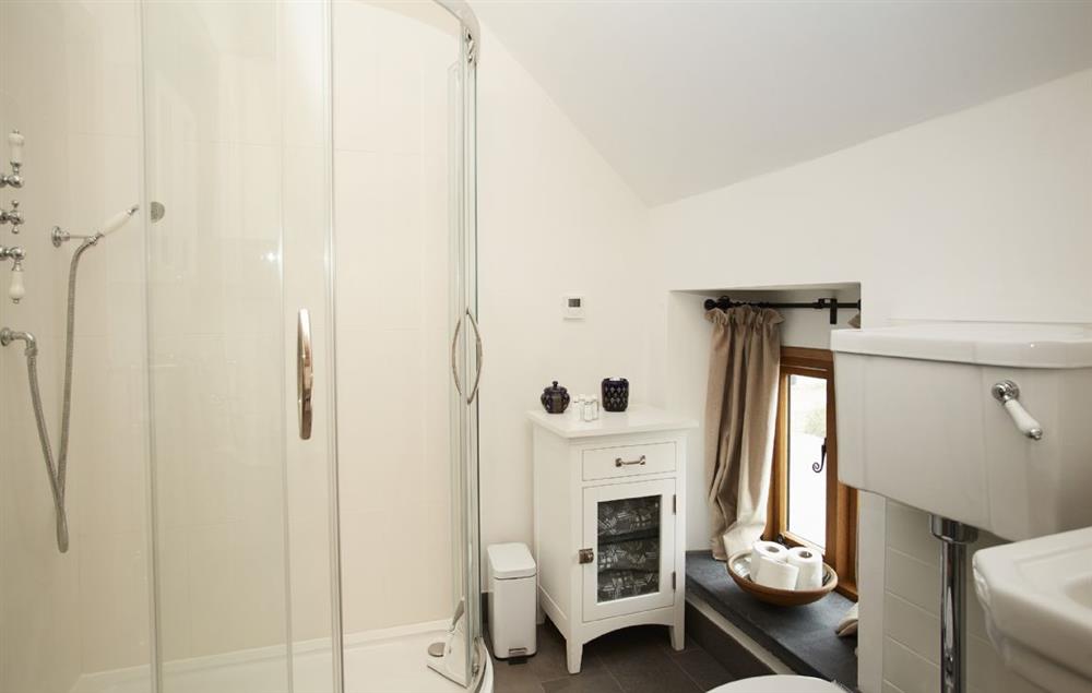 The Orchard master bedroom adjoining bathroom with bath and separate shower (photo 2) at The Longbarn at Caerfallen, Ruthin
