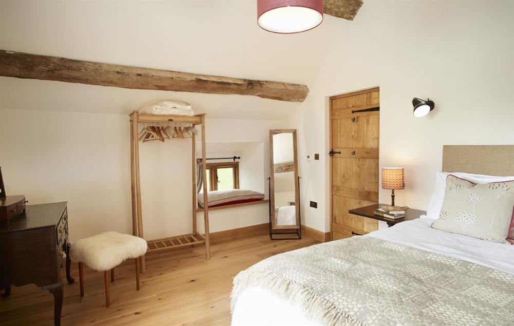 The Orchard master bedroom with 5’ king size bed and adjoining bathroom (photo 2) at The Longbarn at Caerfallen, Ruthin