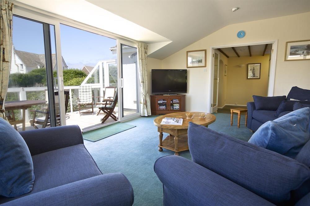 Spacious living room with doors leading to the balcony at The Look Out in Hope Cove, Nr Kingsbridge