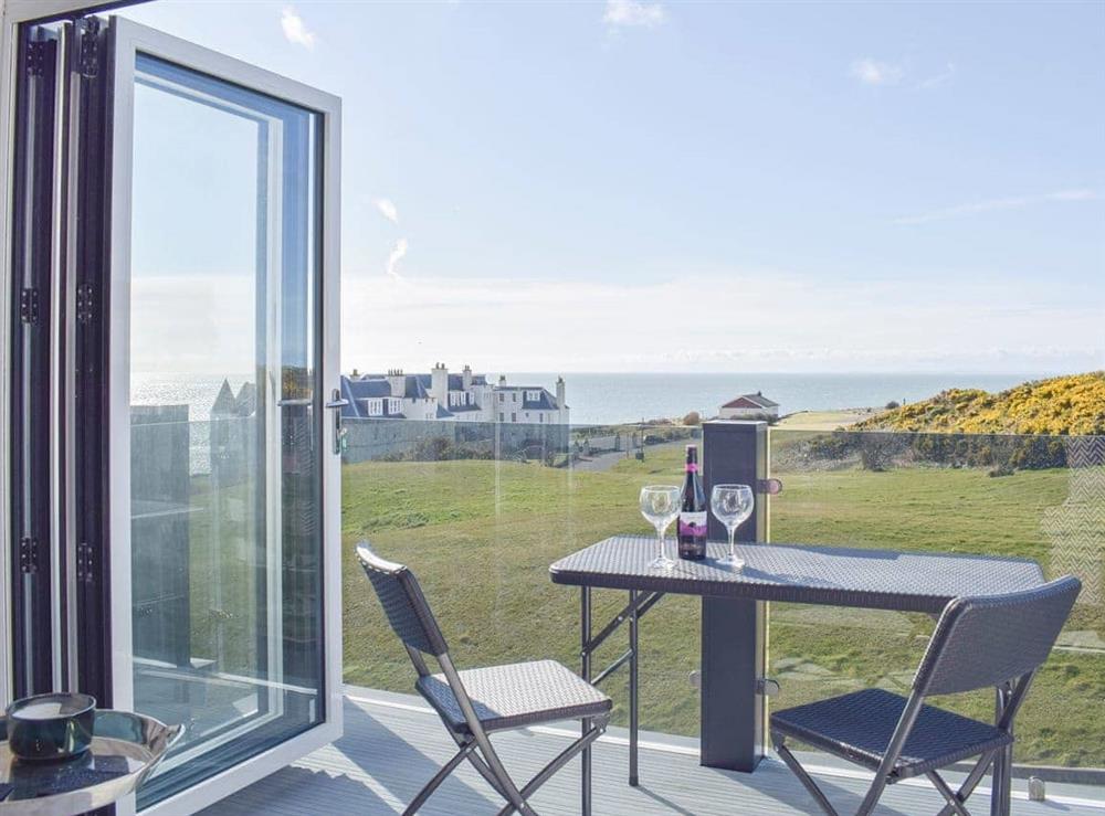 Bi-fold doors opening onto the balcony with a far reaching view at The Lookout in Portpatrick, Wigtownshire
