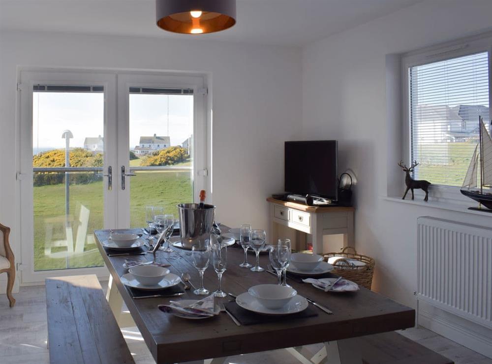 Delightful dining area with doors to the balcony at The Lookout in Portpatrick, Wigtownshire