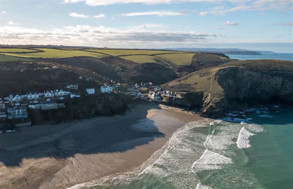 A view of Portreath beach from above with its emerald waters at The Lookout, Portreath
