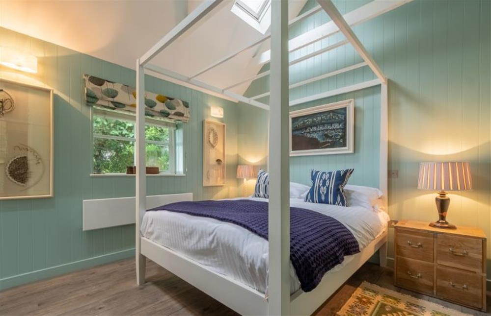 Ground floor: Master bedroom with four poster bed at The Lookout, Salthouse near Holt