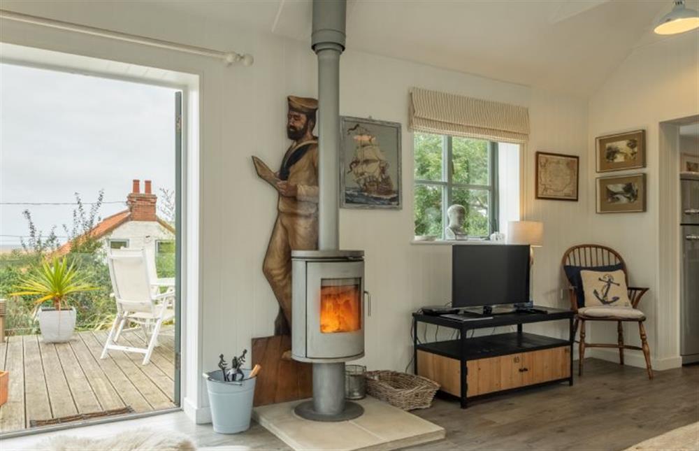 Ground floor: The sitting room has a contemporary wood burning stove at The Lookout, Salthouse near Holt