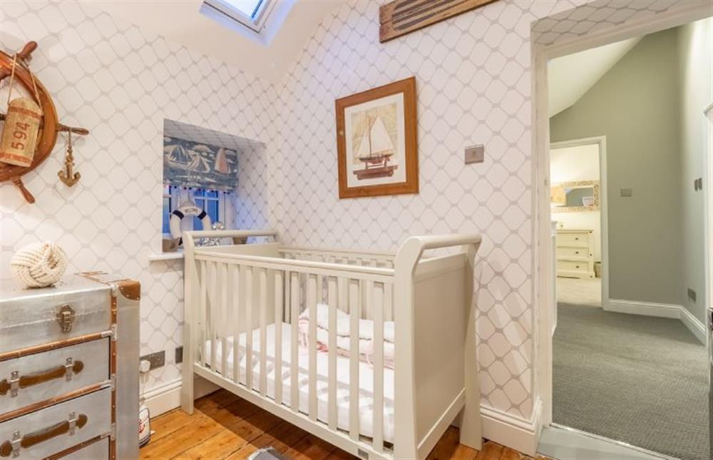 First floor: Bedroom four with cot at The Malthouse, Dersingham near Kings Lynn