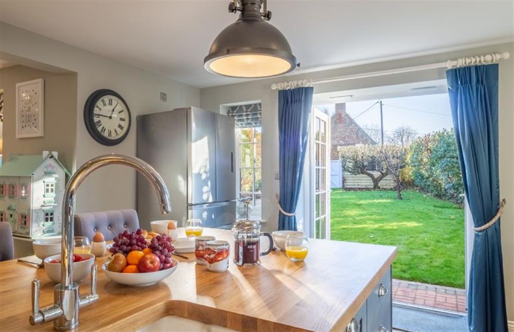 Ground floor: Kitchen with doors to the garden at The Malthouse, Dersingham near Kings Lynn
