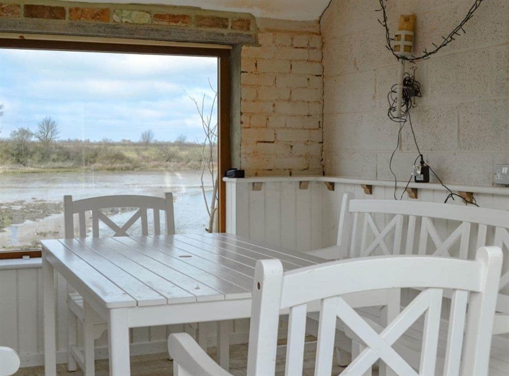 Jetty cottage looking directly over the bay - ideal for dining,