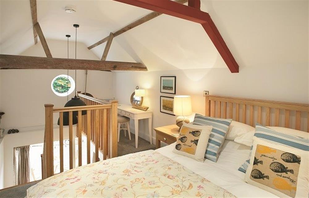 First floor: Mezzanine bedroom on upper level with king size bed (photo 2) at The Maltings, Trunch
