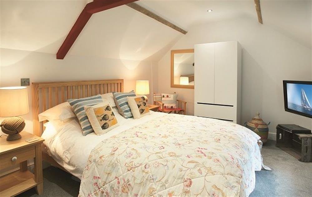 First floor: Mezzanine bedroom on upper level with king size bed at The Maltings, Trunch