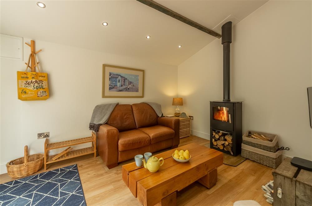 Sitting room with cosy wood burning stove at The Maltings, Trunch