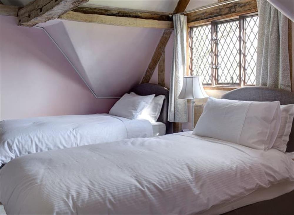 Twin bedroom at The Manor in Blakeney, Gloucestershire