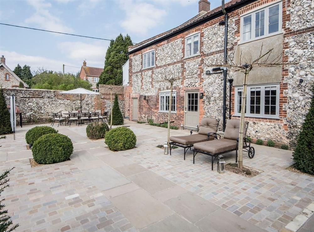 Enclosed garden with patio, terrace, garden furniture, gas barbecue and pizza oven at The Manor House in Syderstone, near Fakenham, Norfolk