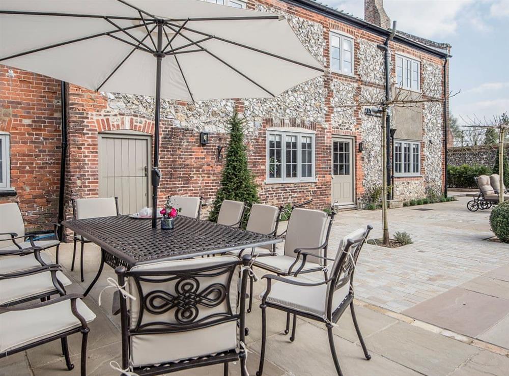 Tranquil garden with furniture. Perfect for al fresco dining at The Manor House in Syderstone, near Fakenham, Norfolk
