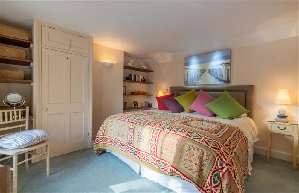 The Manse: Master bedroom with a 6ft king-size bed and a built in cupboard at The Manse, South Creake near Fakenham