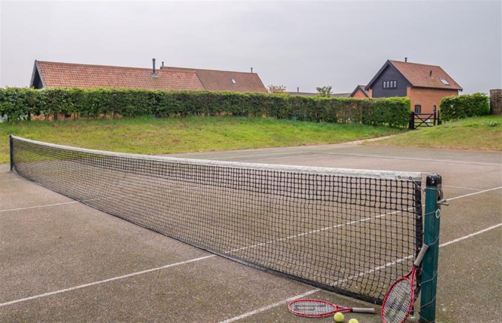 The shared tennis court is available to guests staying